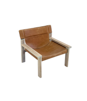 Stylish_vintage_armchair_with_saddle_leather_seat