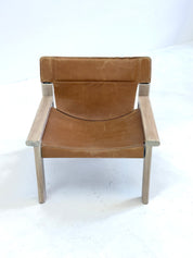 Stylish_vintage_armchair_with_saddle_leather_seat