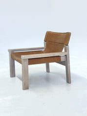 Stylish_vintage_armchair_with_saddle_leather_seat