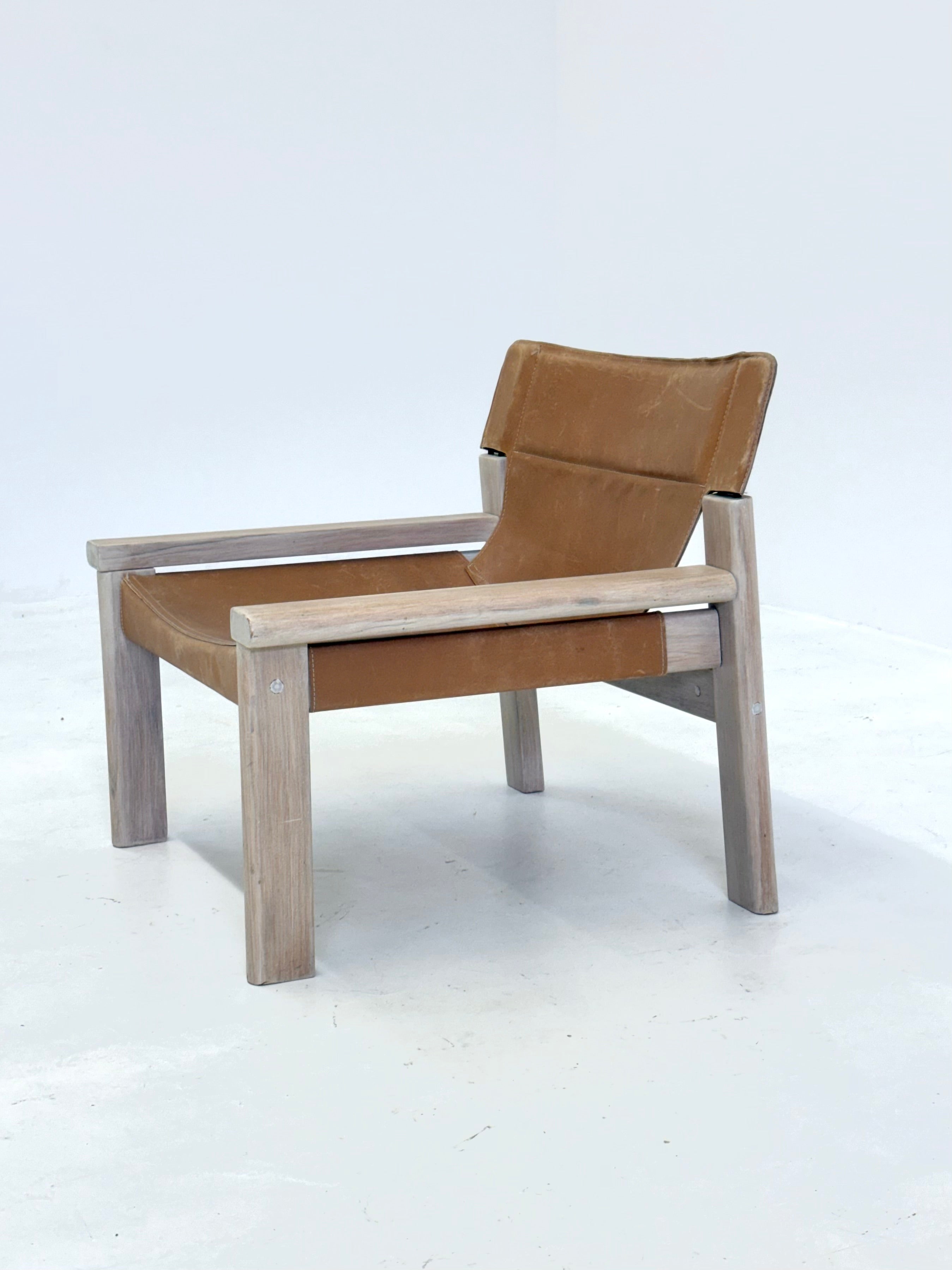 Stylish_vintage_armchair_with_saddle_leather_seat