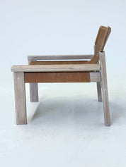 Stylish_vintage_armchair_with_saddle_leather_seat