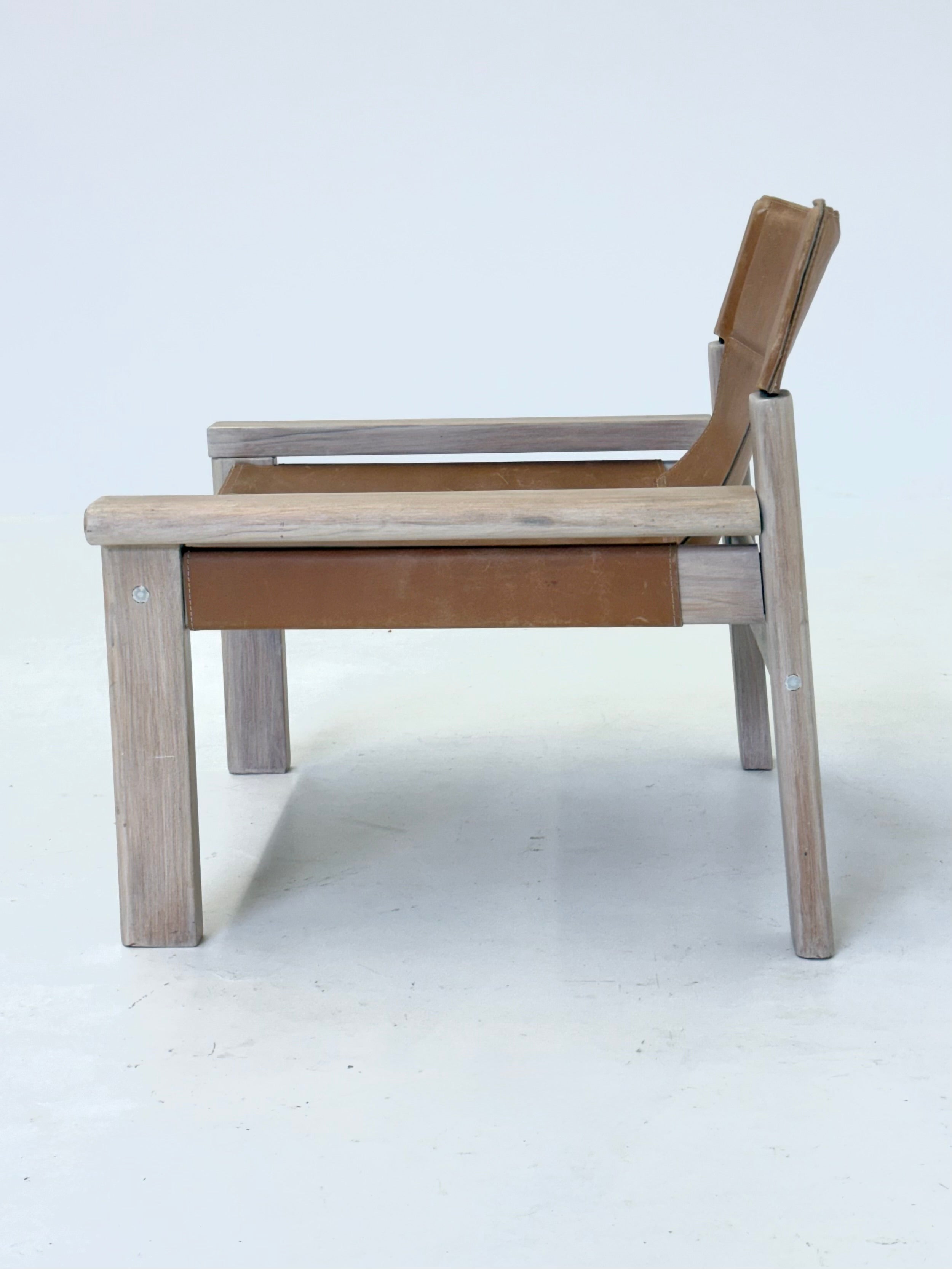 Stylish_vintage_armchair_with_saddle_leather_seat