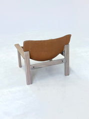 Stylish_vintage_armchair_with_saddle_leather_seat