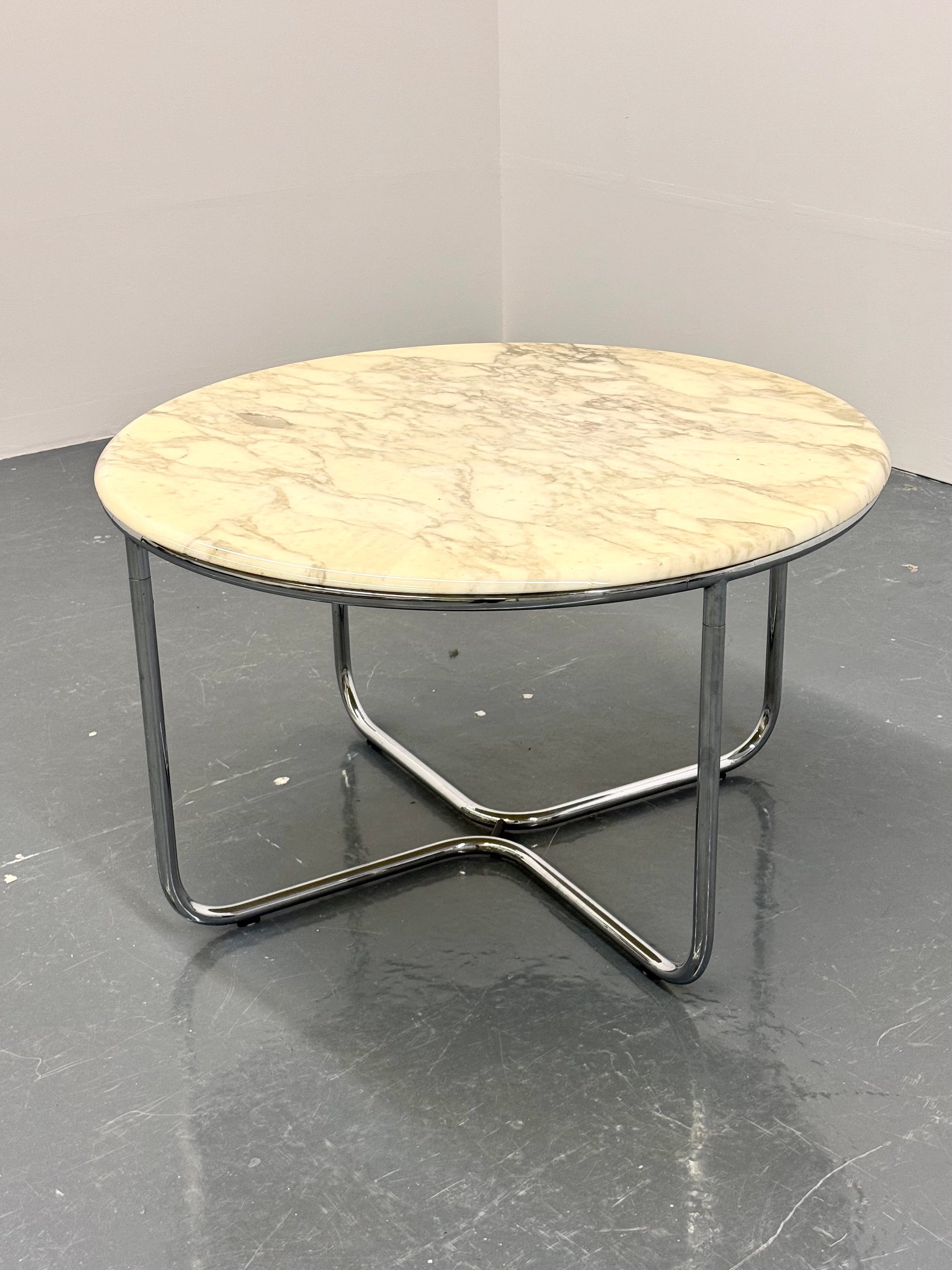 Vintage_round_marble_dining_table_with_tubular_frame_base