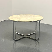 Vintage_round_marble_dining_table_with_tubular_frame_base