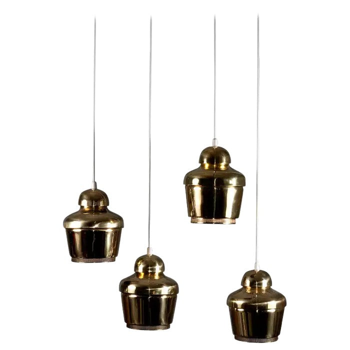 Set_of_4_Alvar_Aalto_circa_1950's_Golden_bell_A330_pendants,_Valaistustyö_Ky