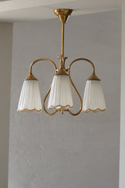 Art_Nouveau_Brass_Chandelier_with_Figural_Detail_and_Pleated_Shades