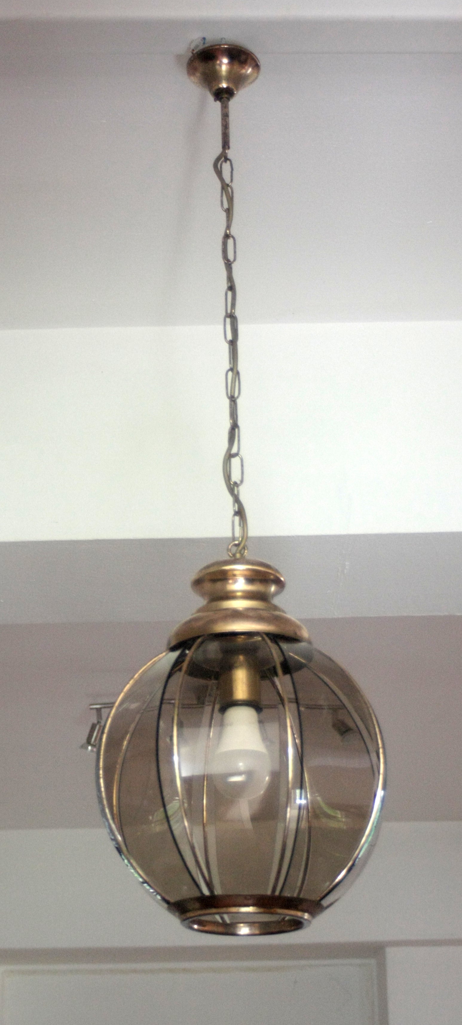 Brass_chandelier_with_smoked_glass_segments,_second_half_of_the_20th_century