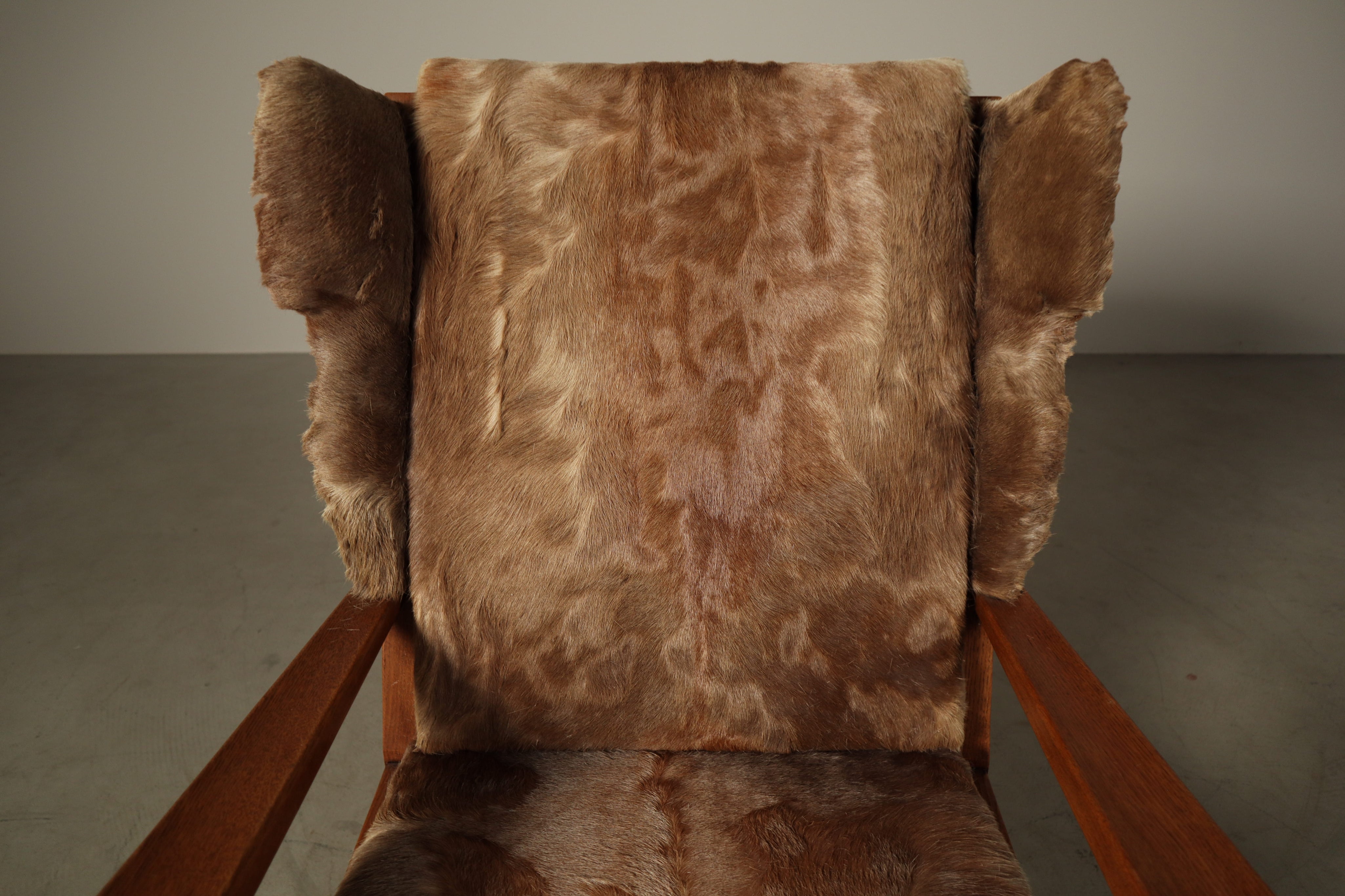 Set_of_Brutalist_Solid_Oak_Lounge_Chair_and_Matching_Ottoman_with_Original_Goat_Hide_Upholstery,_1960s