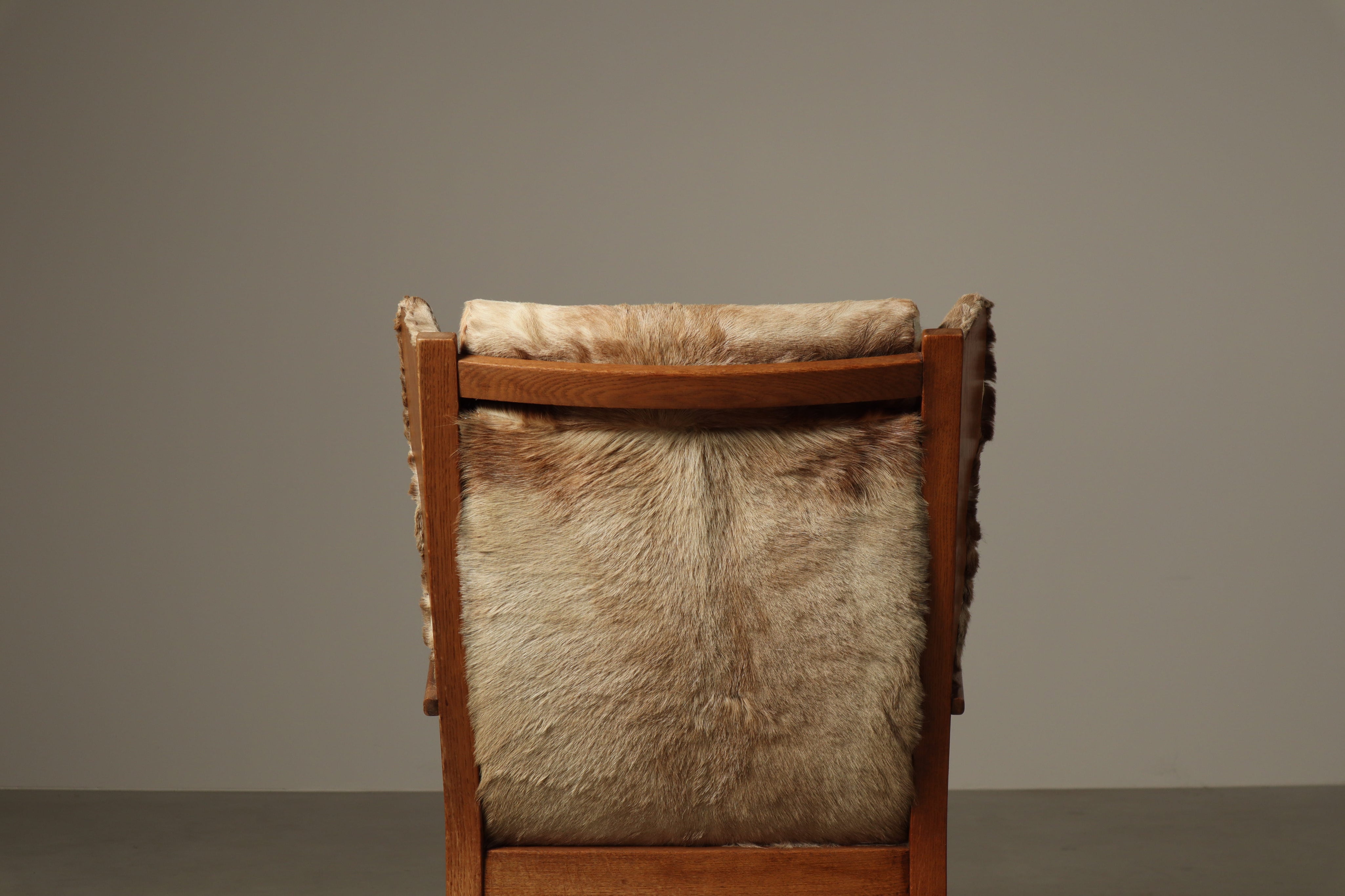 Set_of_Brutalist_Solid_Oak_Lounge_Chair_and_Matching_Ottoman_with_Original_Goat_Hide_Upholstery,_1960s
