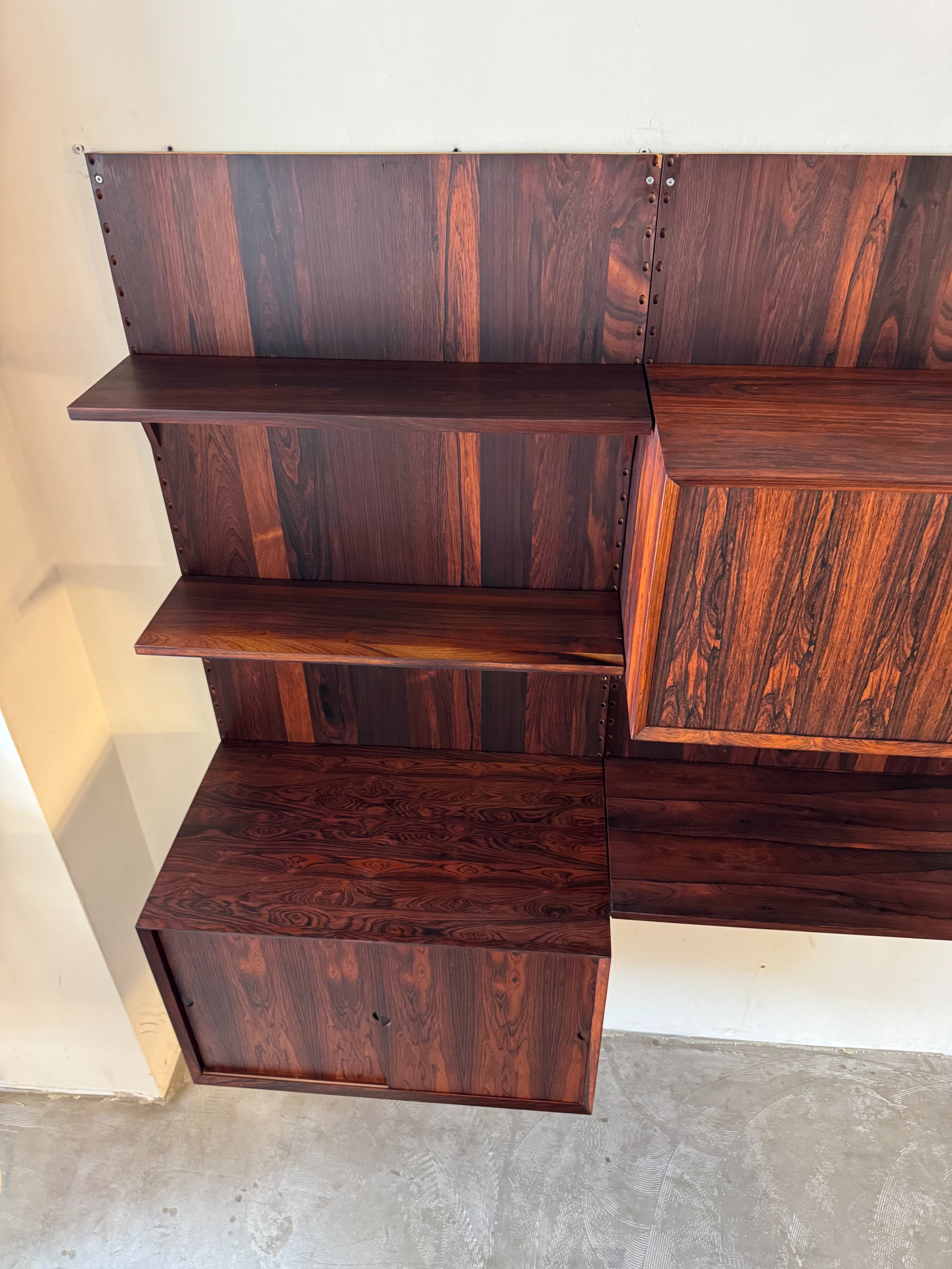 Cado_Rosewood_Wall_System_by_Poul_Cadovius,_Denmark,_1960s