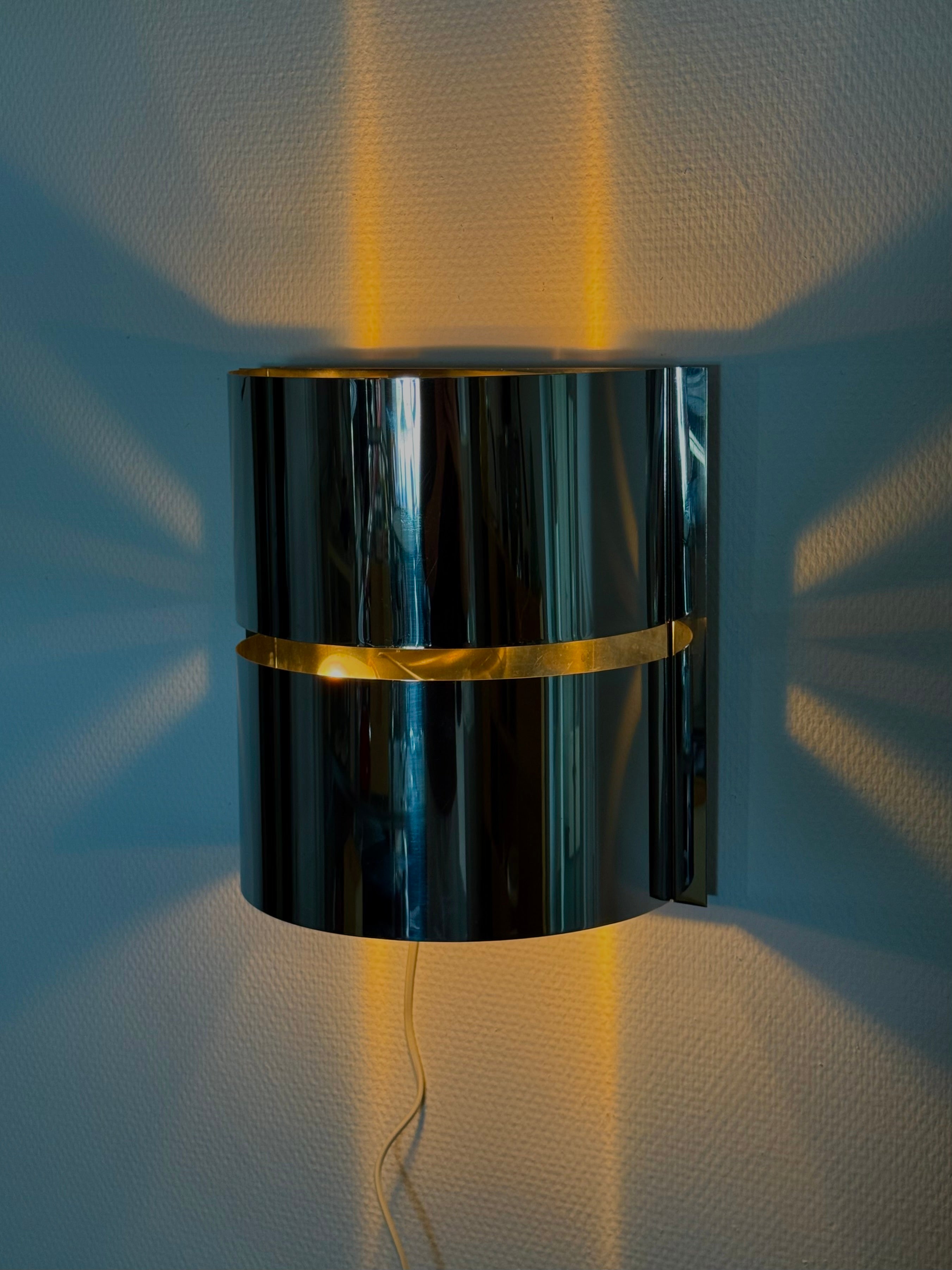 Chrome_space_age_wall_lamp_by_Minilumi_Design