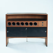 Erik_Buch_boomerang_dry_bar_cabinet_in_teak_for_Dyrlund,_1960s