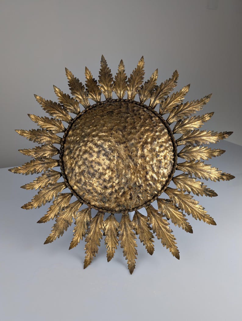 Golden_sunburst_ceiling_or_wall_lamp_with_leaf_rays_1950s