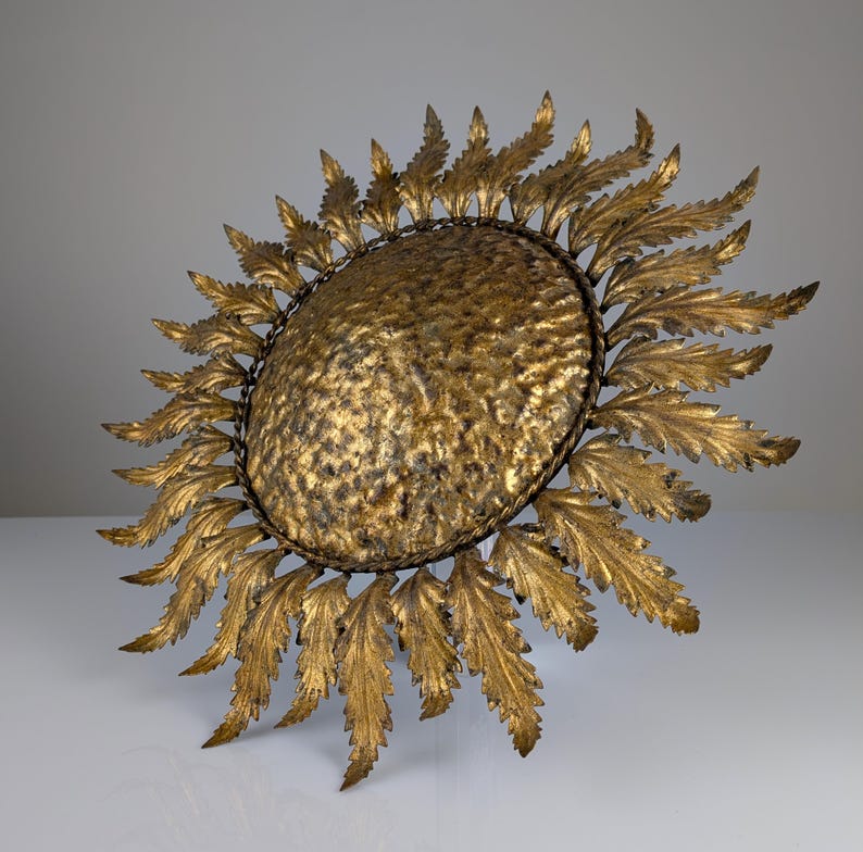 Golden_sunburst_ceiling_or_wall_lamp_with_leaf_rays_1950s