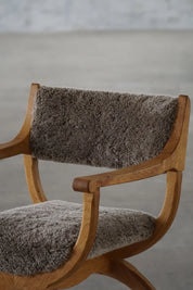 Henning_Kjærnulf_‘Kurul’_Armchair_in_Oak_and_Lambswool,_Danish_Modern_Design