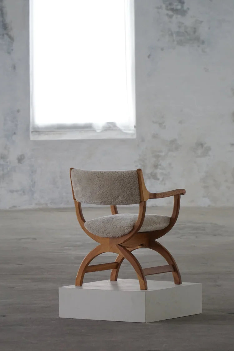 Henning_Kjærnulf_‘Kurul’_Armchair_in_Oak_and_Lambswool,_Danish_Modern_Design