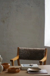 Henning_Kjærnulf_‘Kurul’_Armchair_in_Oak_and_Lambswool,_Danish_Modern_Design