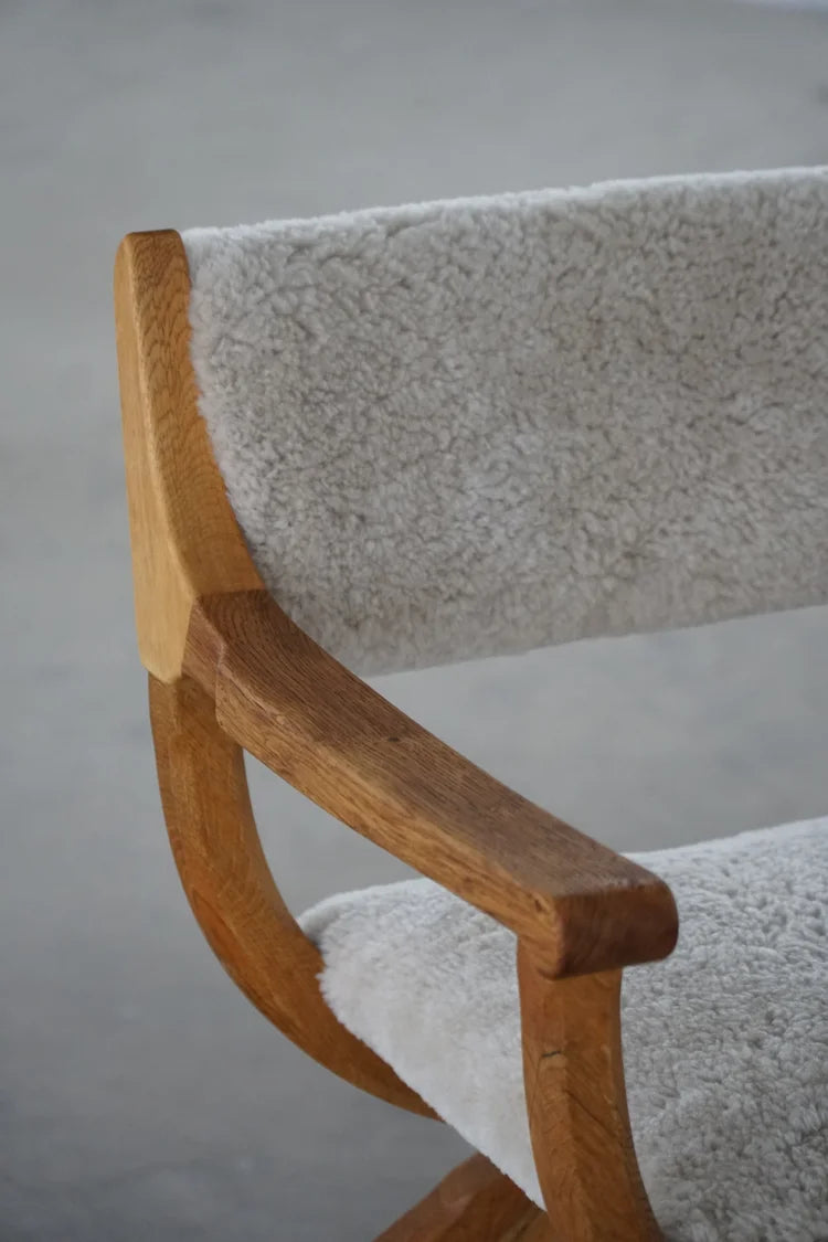 Henning_Kjærnulf_‘Kurul’_Armchair_in_Oak_and_Lambswool,_Danish_Modern_Design
