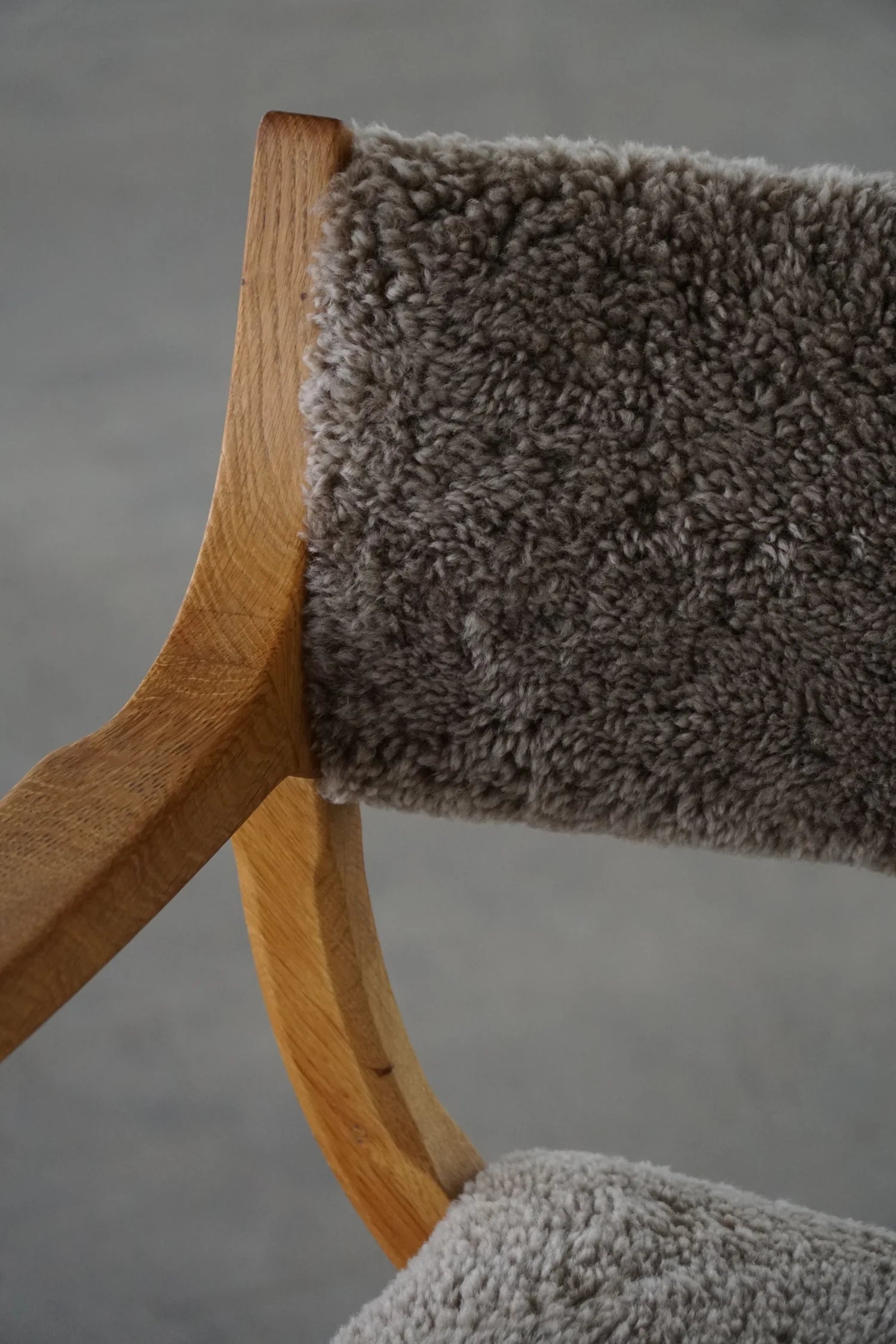 Henning_Kjærnulf_‘Kurul’_Armchair_in_Oak_and_Lambswool,_Danish_Modern_Design