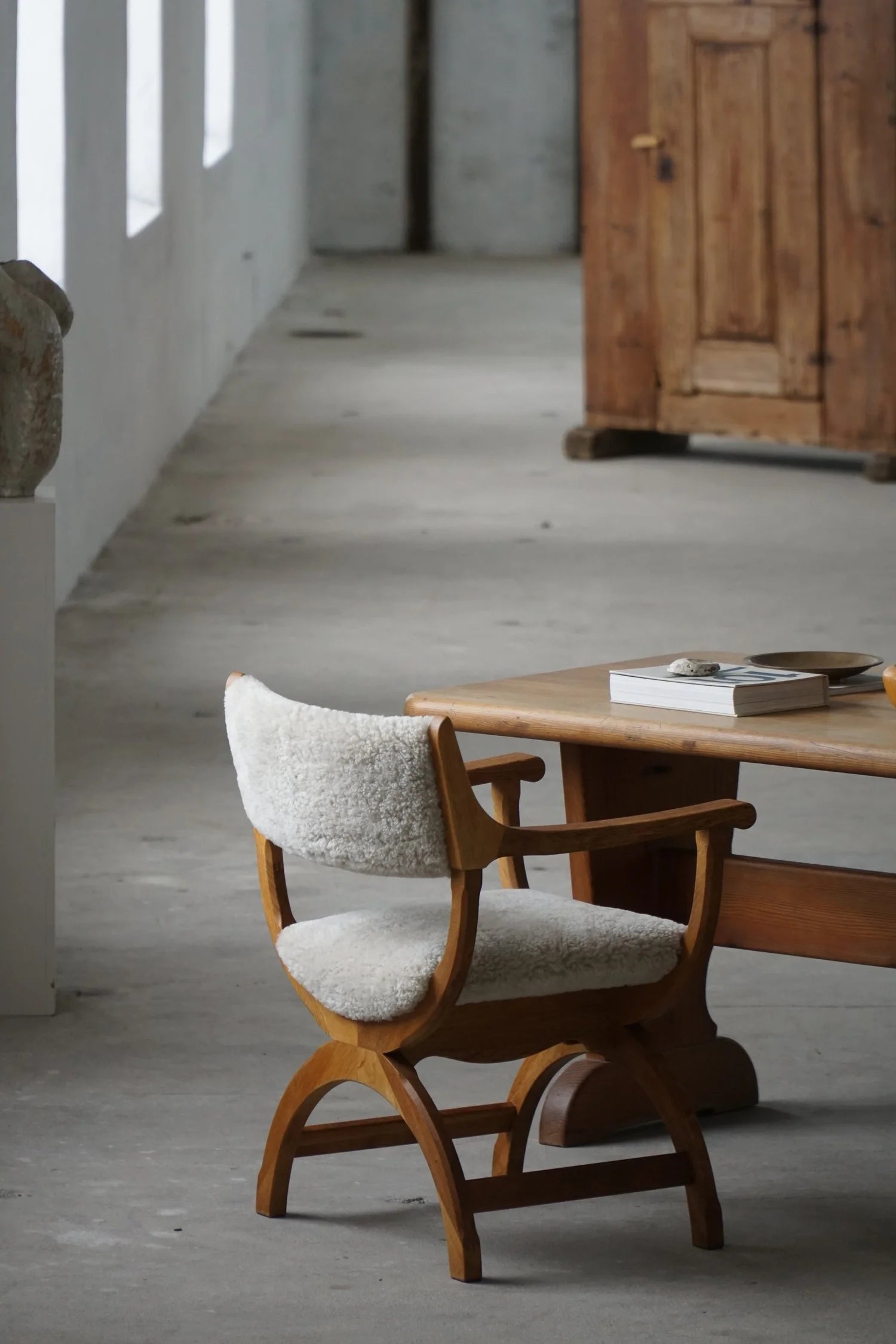 Henning_Kjærnulf_‘Kurul’_Armchair_in_Oak_and_Lambswool,_Danish_Modern_Design