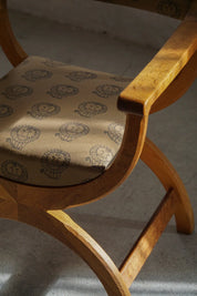 Henning_Kjærnulf_‘Kurul’_Armchair_in_Oak_with_Lisa_Larson_Textile