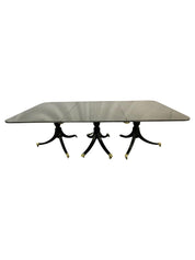 Hollywood_Regency_Triple_Pedestal_Ebony_Dining_Table,_Maison_Jansen_1920s