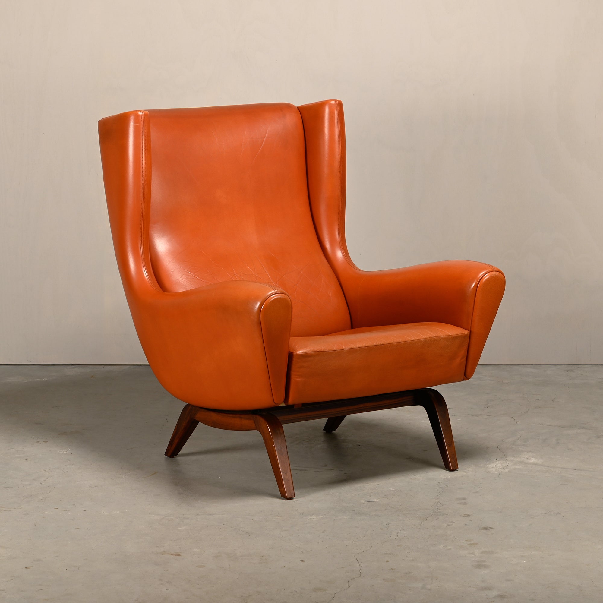 Illum_Wikkelsø_Model_110_Wingback_Armchair_in_Cognac_Leather,_Denmark