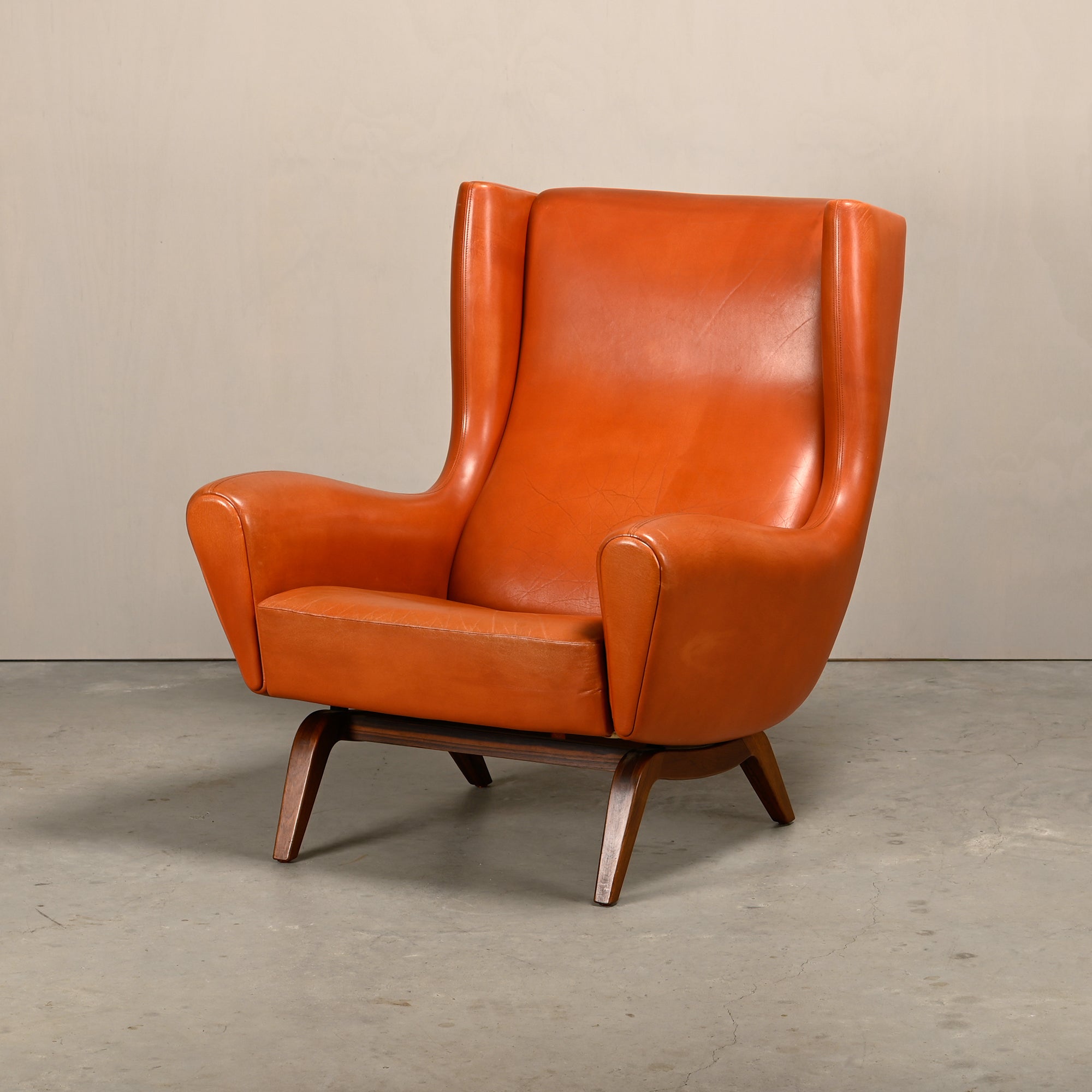 Illum_Wikkelsø_Model_110_Wingback_Armchair_in_Cognac_Leather,_Denmark