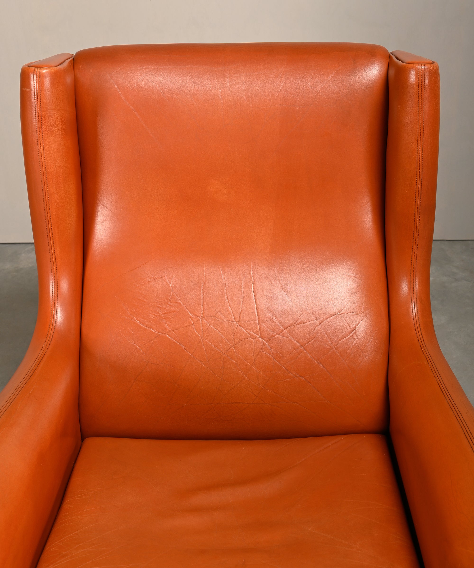 Illum_Wikkelsø_Model_110_Wingback_Armchair_in_Cognac_Leather,_Denmark