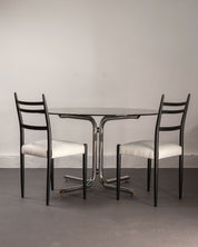 Round_Dining_Table_made_of_Tubular_Chrome_Steel_and_Smoked_Glass