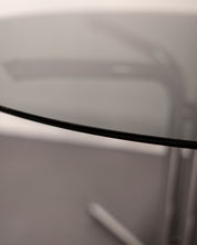 Round_Dining_Table_made_of_Tubular_Chrome_Steel_and_Smoked_Glass