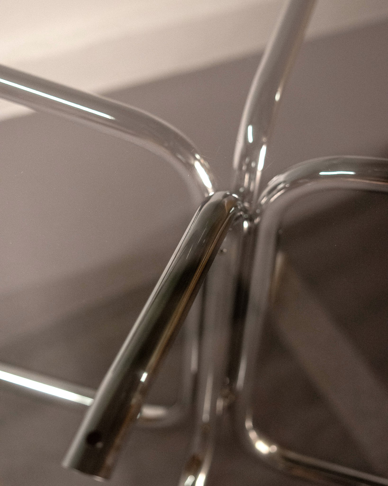 Round_Dining_Table_made_of_Tubular_Chrome_Steel_and_Smoked_Glass