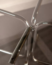 Round_Dining_Table_made_of_Tubular_Chrome_Steel_and_Smoked_Glass