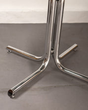 Round_Dining_Table_made_of_Tubular_Chrome_Steel_and_Smoked_Glass