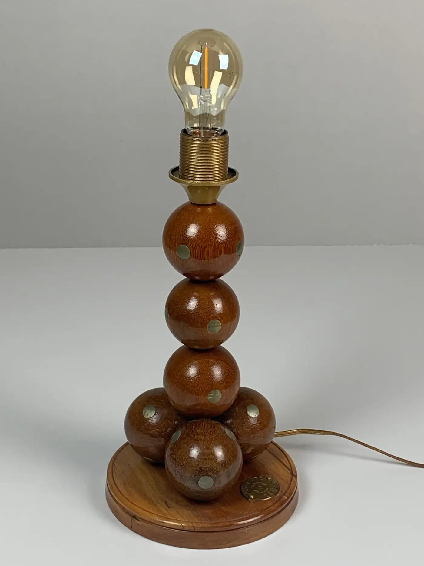 Dutch_handcrafted_commemorative_wooden_sphere_ball_table_lamp,_1976