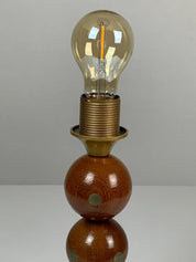 Dutch_handcrafted_commemorative_wooden_sphere_ball_table_lamp,_1976