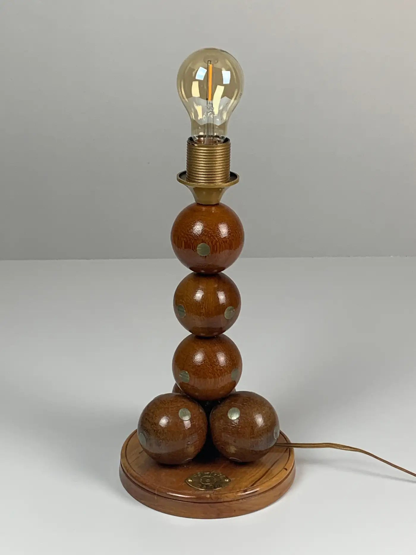Dutch_handcrafted_commemorative_wooden_sphere_ball_table_lamp,_1976