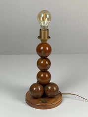 Dutch_handcrafted_commemorative_wooden_sphere_ball_table_lamp,_1976