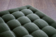 Le_bambole_bed_in_green_velvet_By_Mario_Bellini_for_B&B_Italia,_1970s