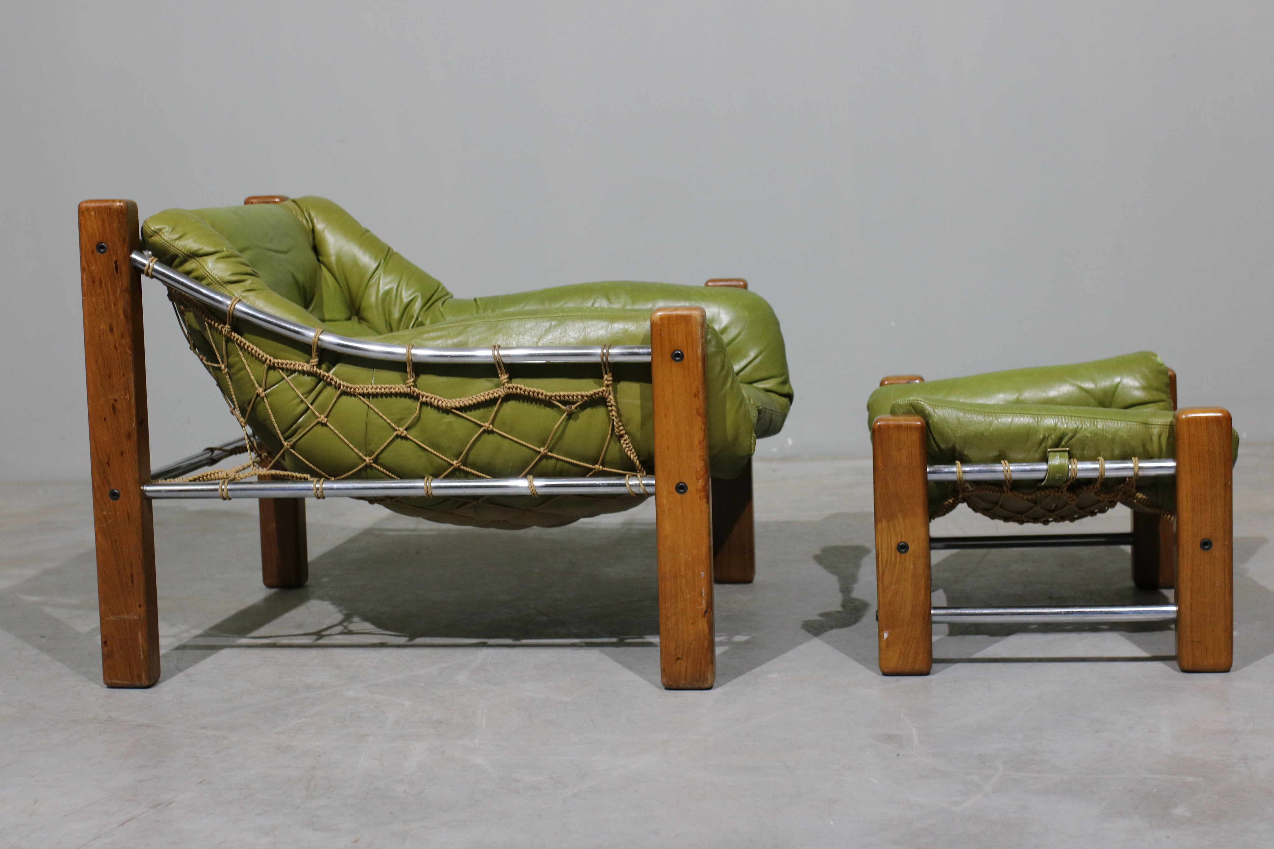 Leather_Armchair_and_Ottoman_by_Jean_Gillon