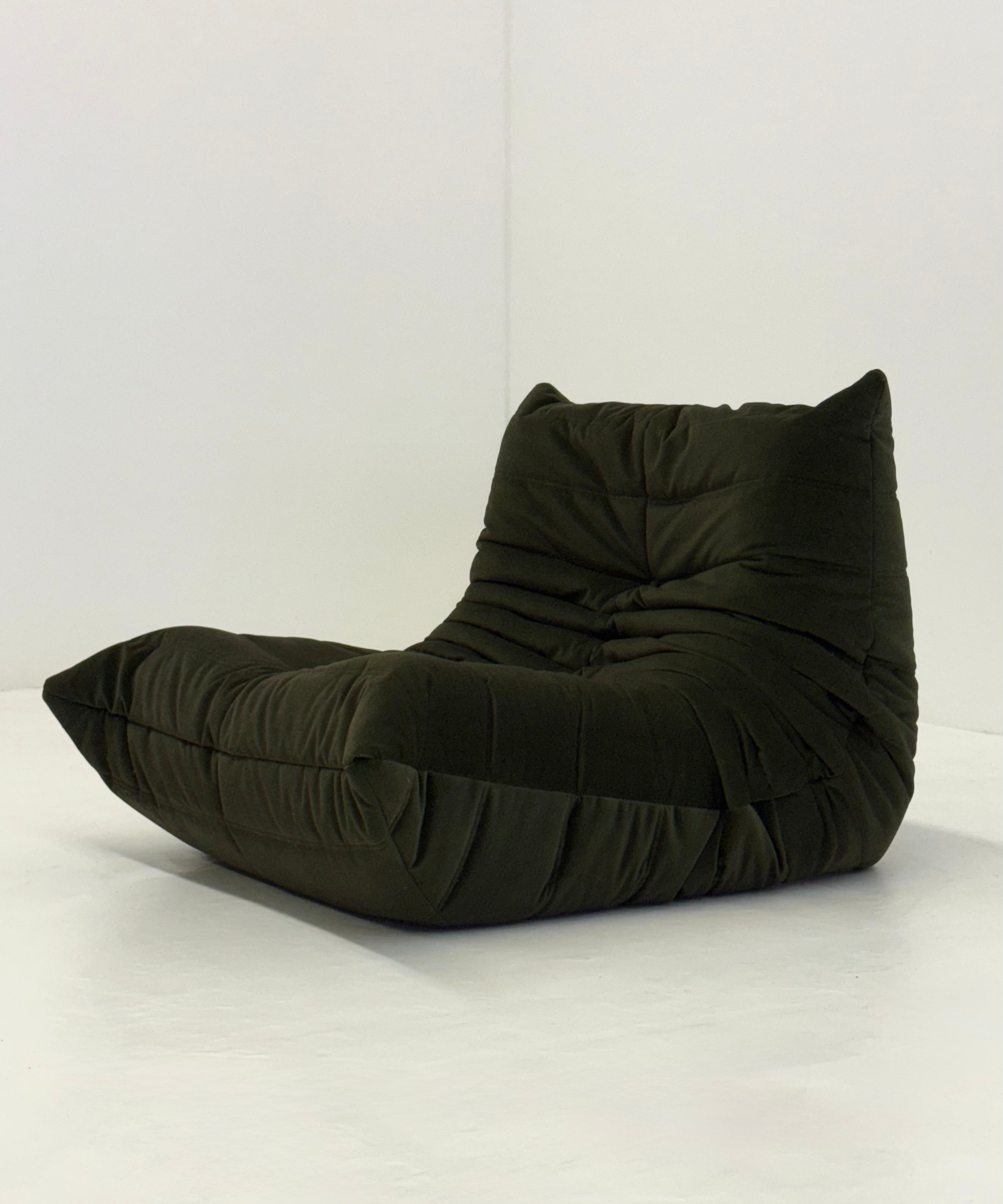 Ligne_Roset_Togo_1-seater_in_dark_green_velvet