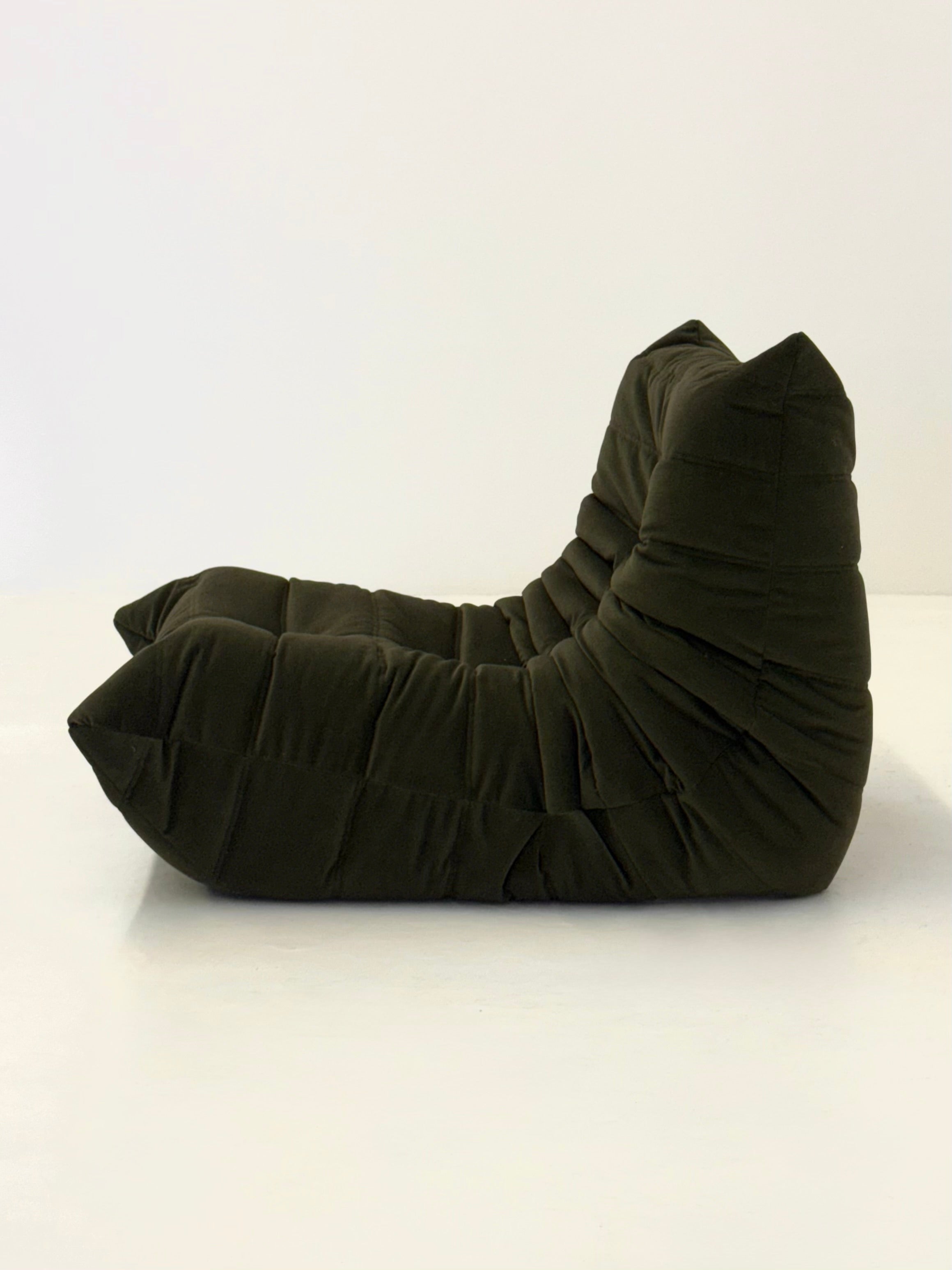 Ligne_Roset_Togo_1-seater_in_dark_green_velvet