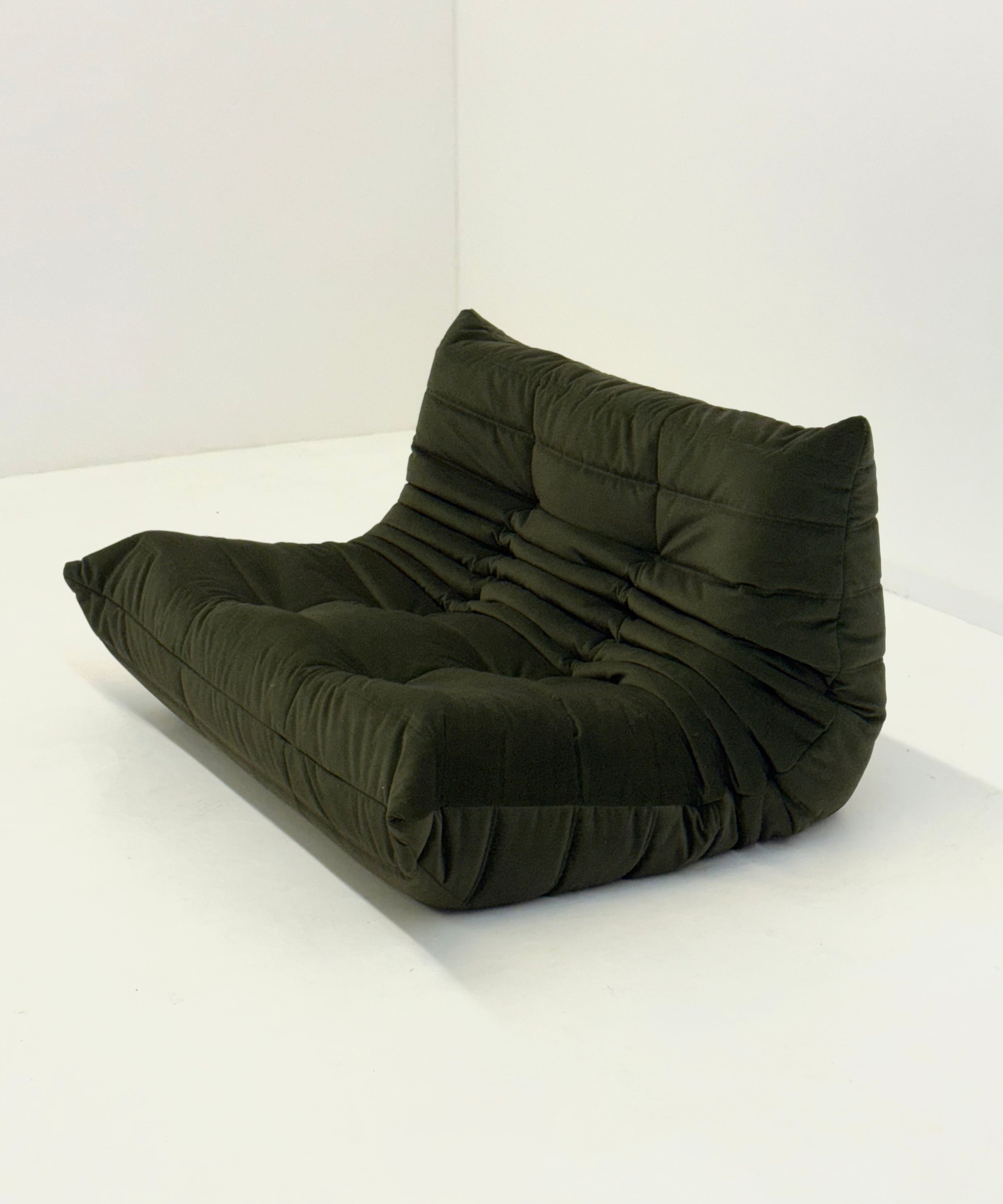 Ligne_Roset_Togo_2-seat_element_in_dark_green_velvet