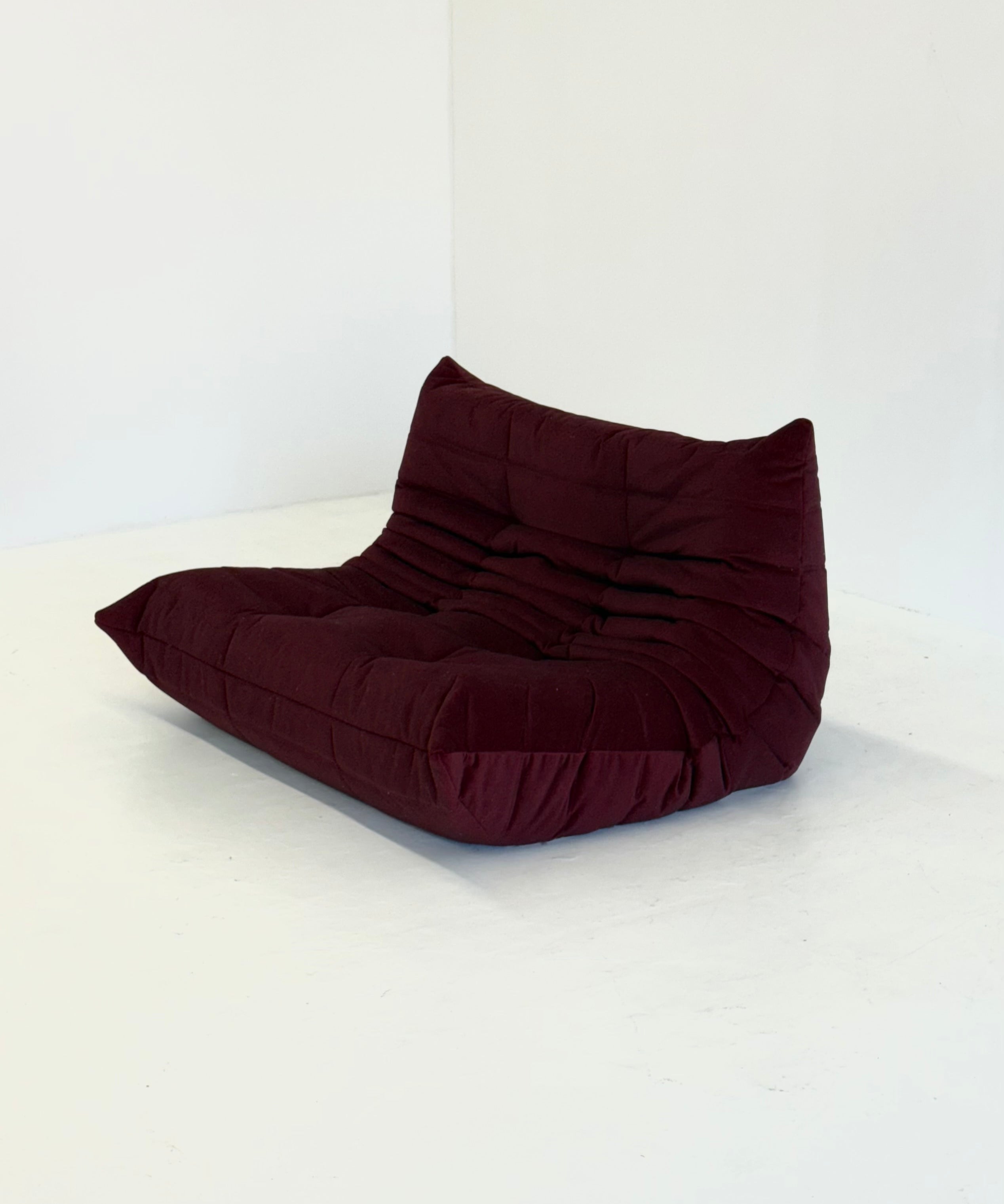 Ligne_Roset_Togo_2-seater_in_burgundy_red_velvet