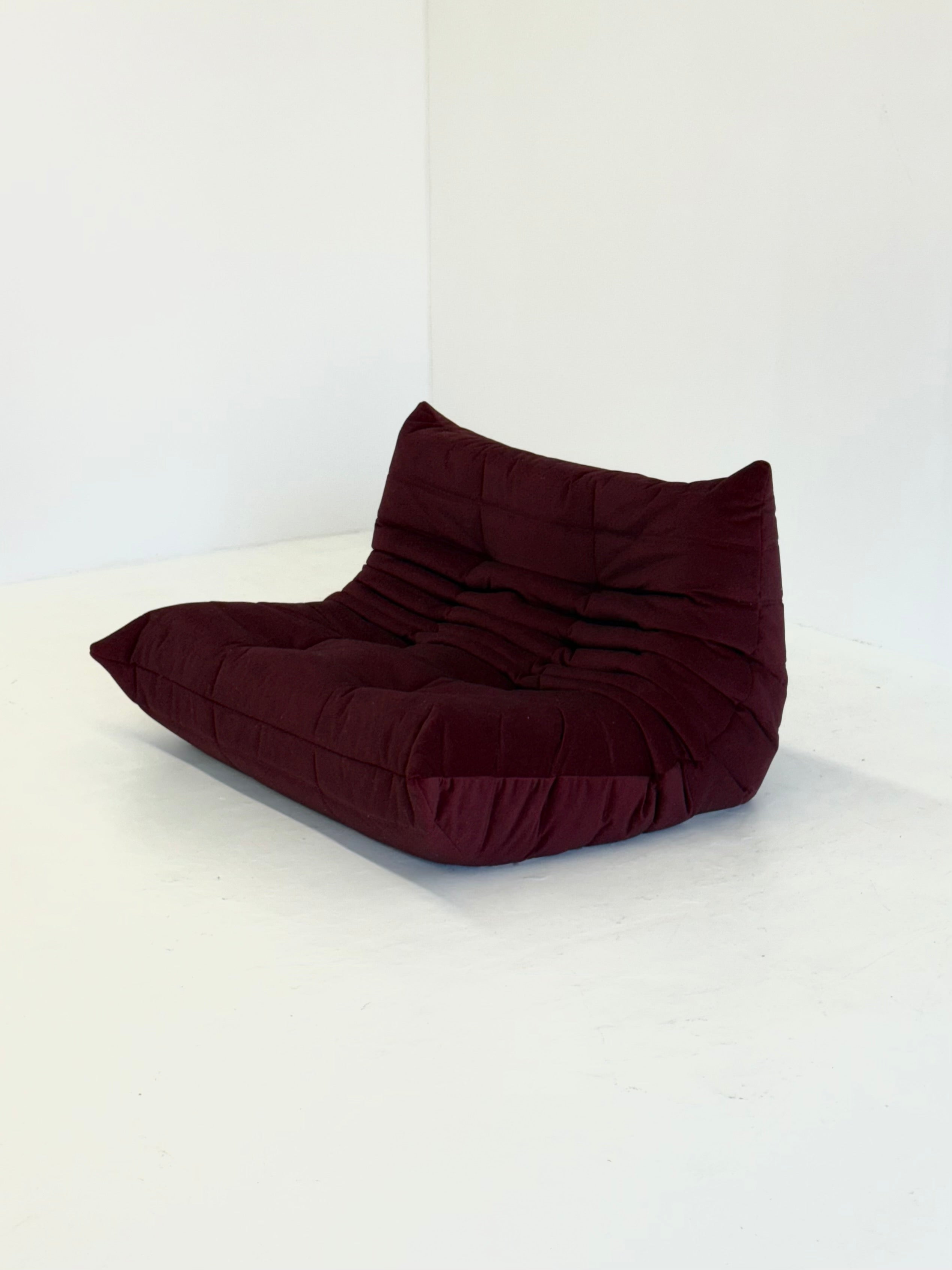 Ligne_Roset_Togo_2-seater_in_burgundy_red_velvet