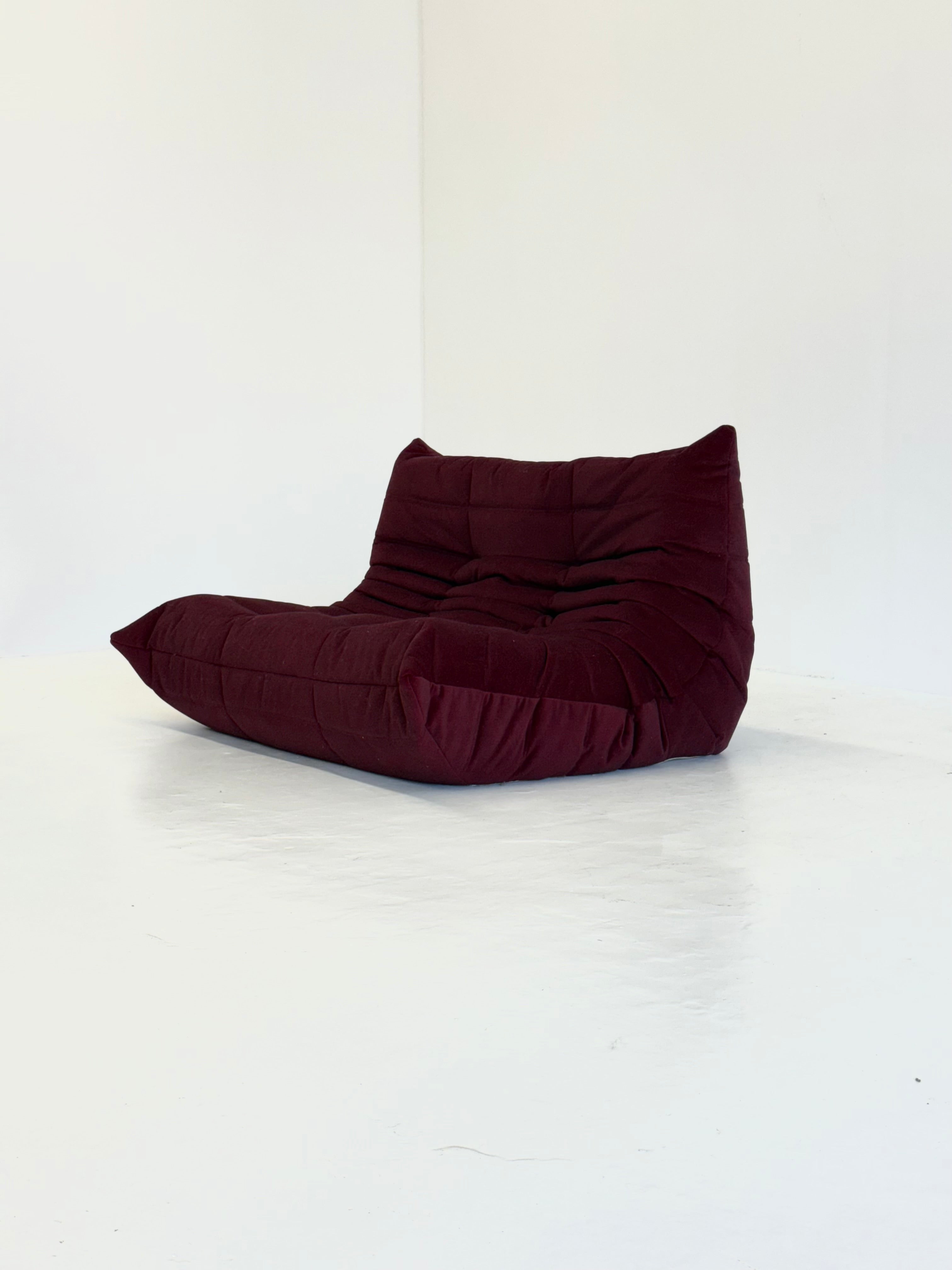 Ligne_Roset_Togo_2-seater_in_burgundy_red_velvet