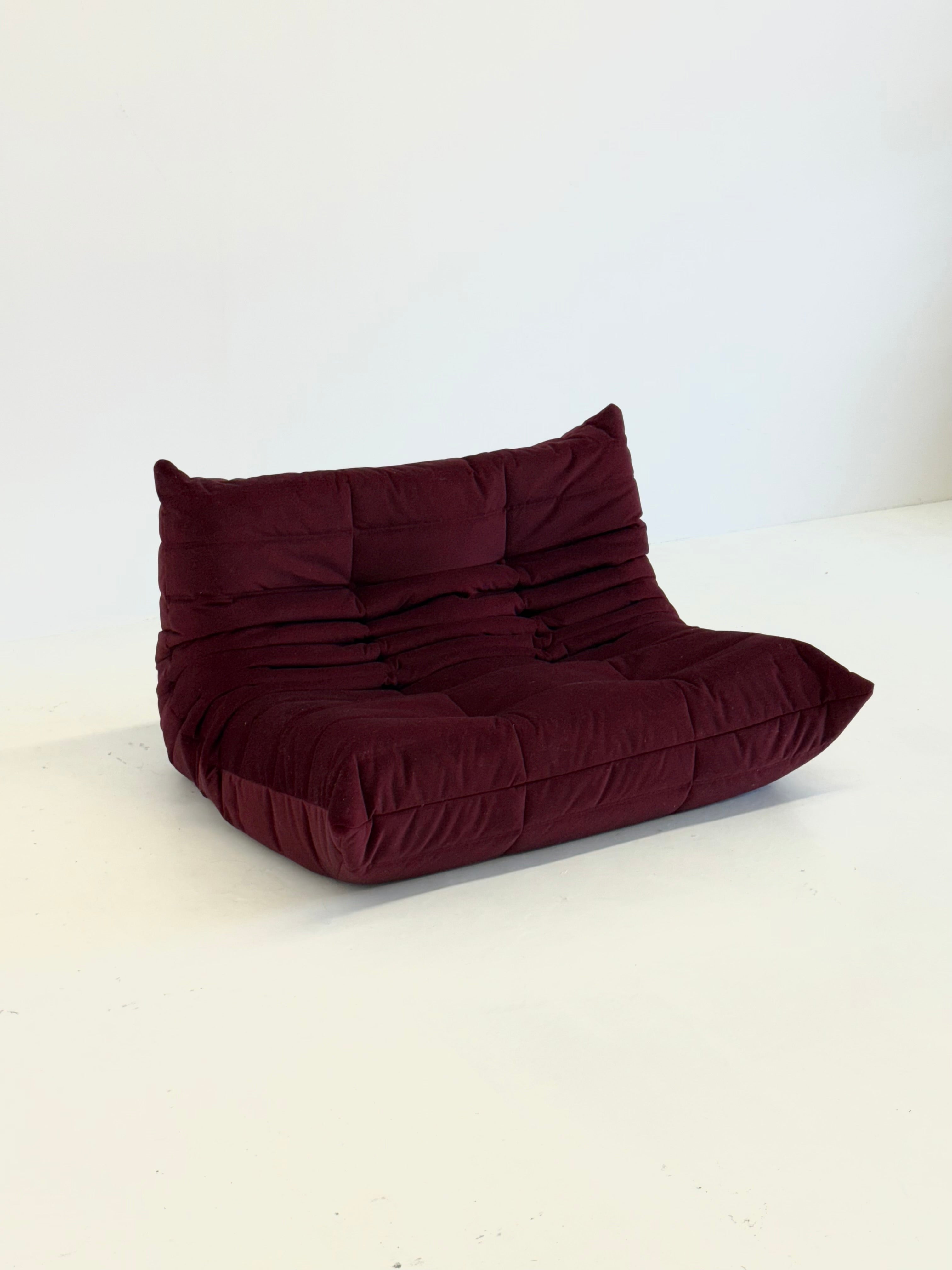Ligne_Roset_Togo_2-seater_in_burgundy_red_velvet