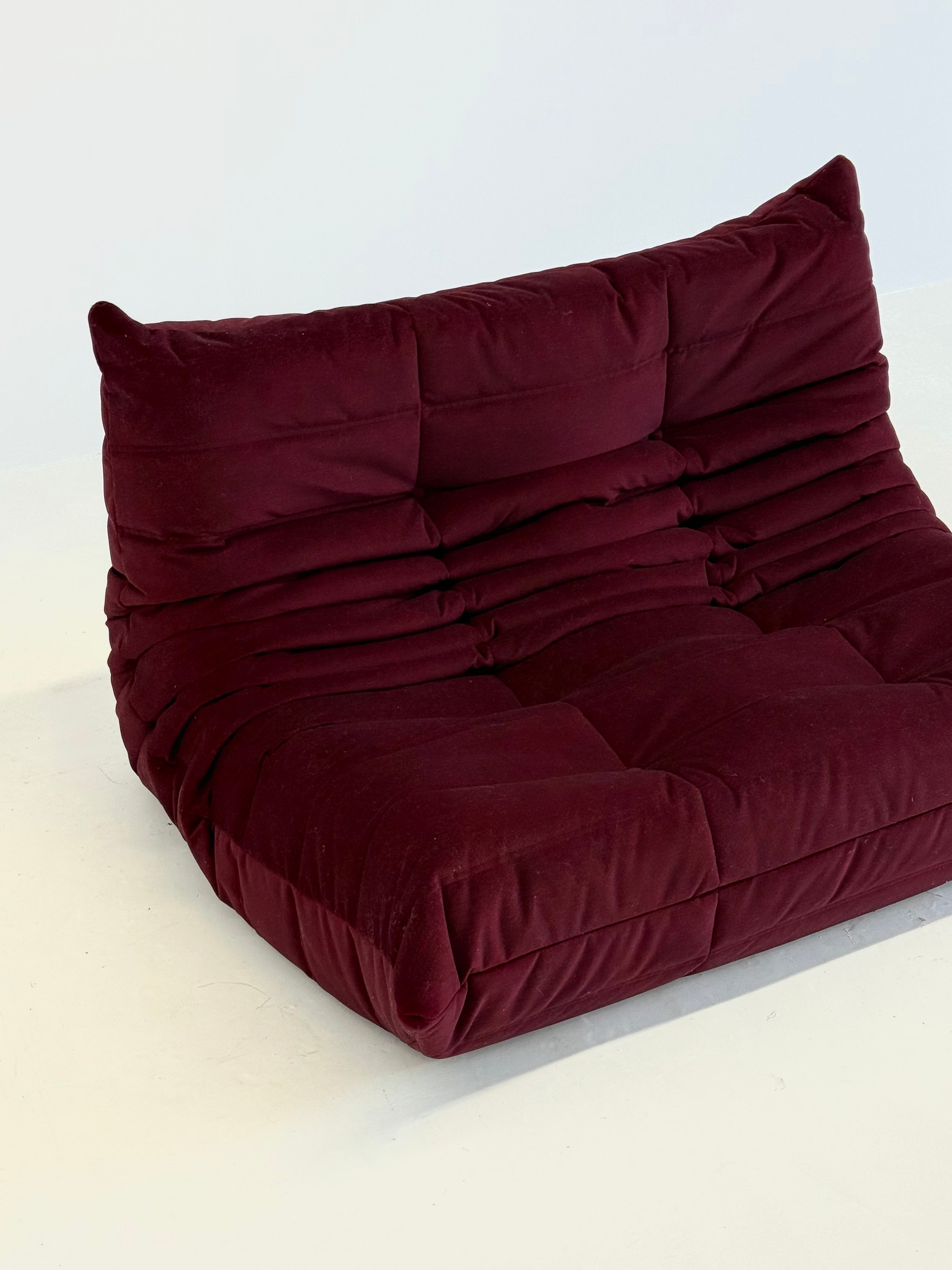 Ligne_Roset_Togo_2-seater_in_burgundy_red_velvet
