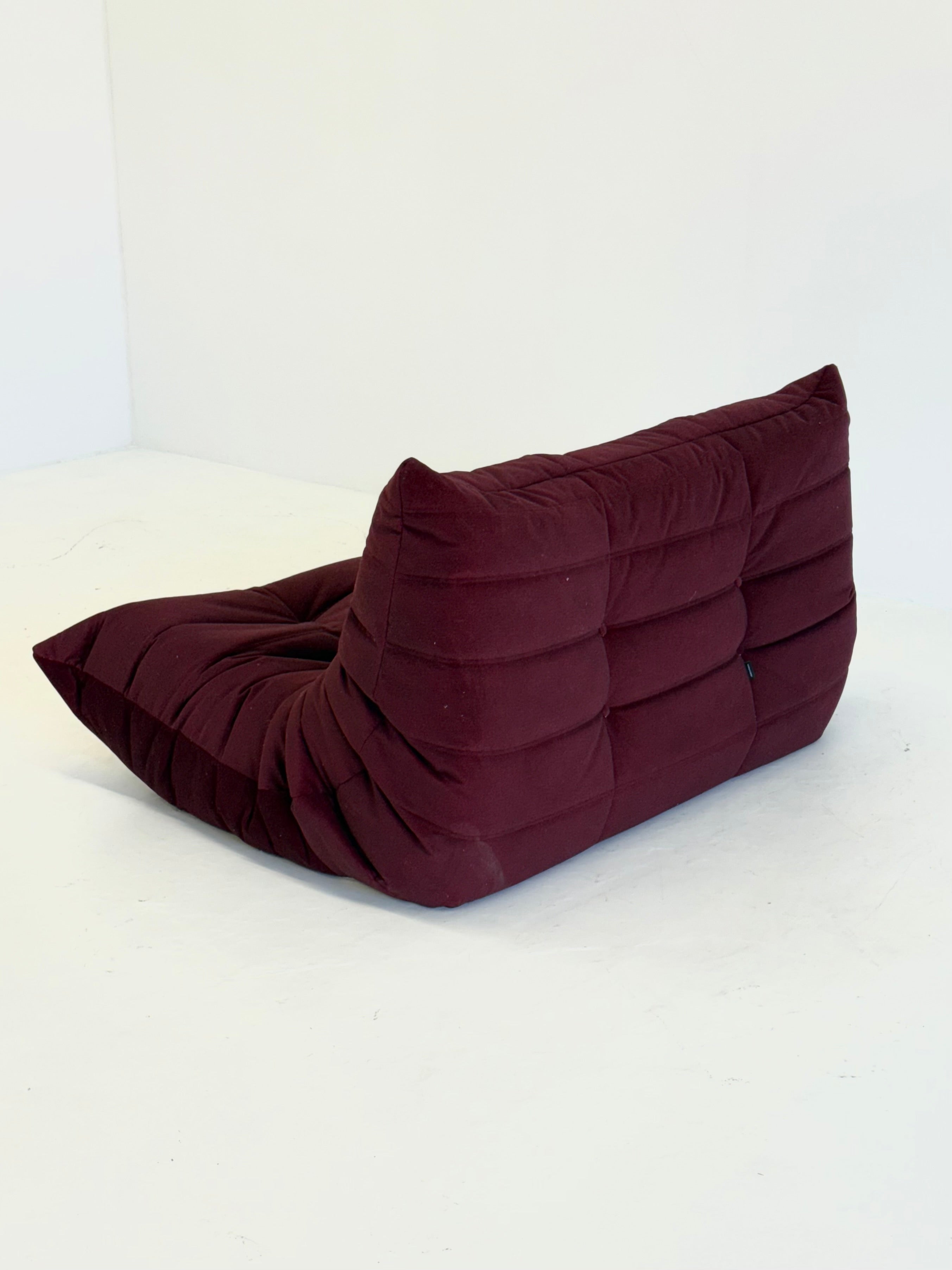 Ligne_Roset_Togo_2-seater_in_burgundy_red_velvet